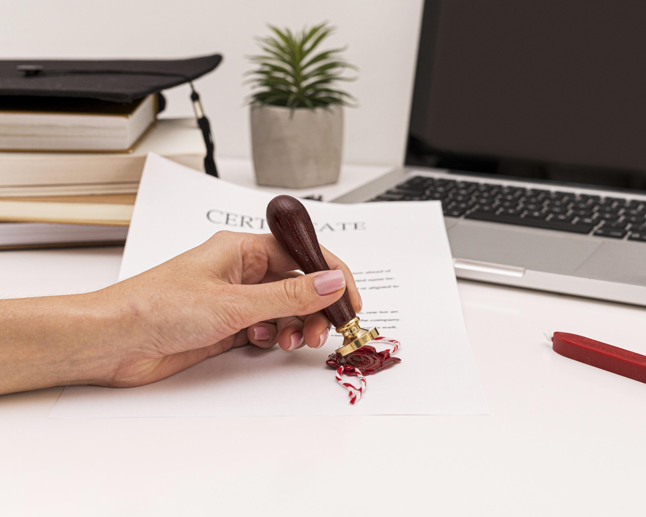 pThe Most Common Documents That Need a Notaryerson-using-wax-seal-graduation-diploma-certificate The Most Common Documents That Need a Notary